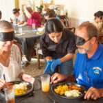 Patrons are blindfolded during the Dining in the Dark event.