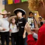 Students take photos at Hispanic Heritage Month celebrations