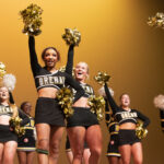 Cheerleaders on stage during Spirit Week