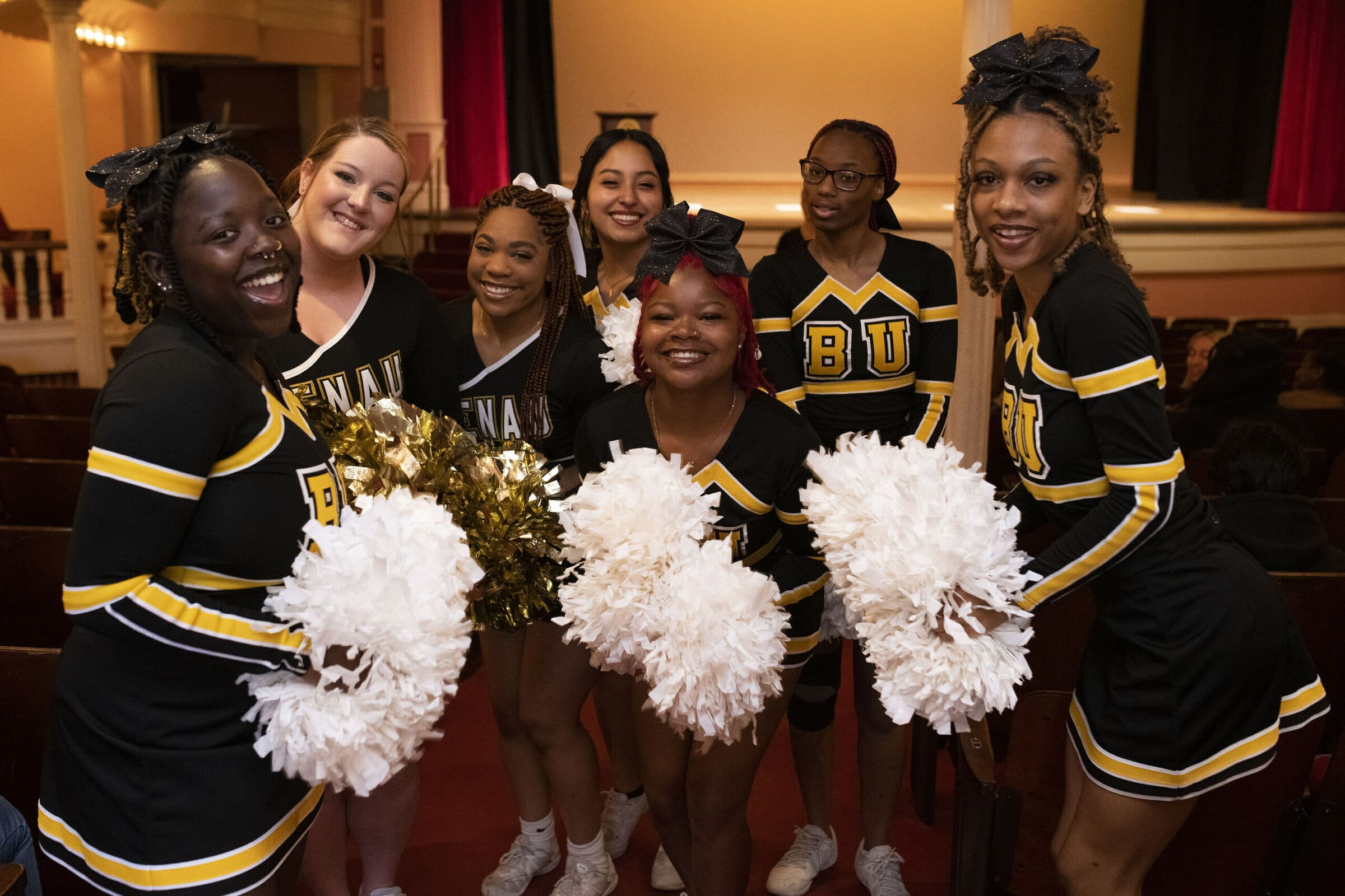 Brenau cheerleaders pose in Pearce Auditorium