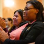 Students clap during Grrrl PowHER Hour.