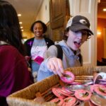 A student looks at pins during Grrrl PowHER Hour.