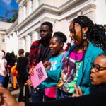 Students take pictures during Grrrl PowHER Hour.