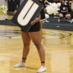 A Brenau cheerleader holds a giant letter during the Spirit Week pep rally.
