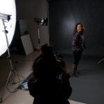 Students use photography studio for portraits.