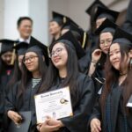 Members of the first cohort of the 2+2 partnership between Anhui Normal University and Brenau University smile with their diplomas following the 2018 Spring Commencement Ceremony on Saturday, May 5, on Brenau University's historic Gainesville campus. (Nick Bowman for Brenau University)