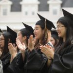 Members of the first cohort of the 2+2 partnership between Anhui Normal University and Brenau University smile and applaud during the 2018 Spring Commencement Ceremony on Saturday, May 5, on Brenau University's historic Gainesville campus. (Nick Bowman for Brenau University)