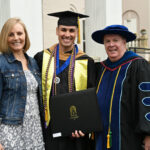 Gil Rodriguez, his wife and Dr. Bill Haney after the university graduation
