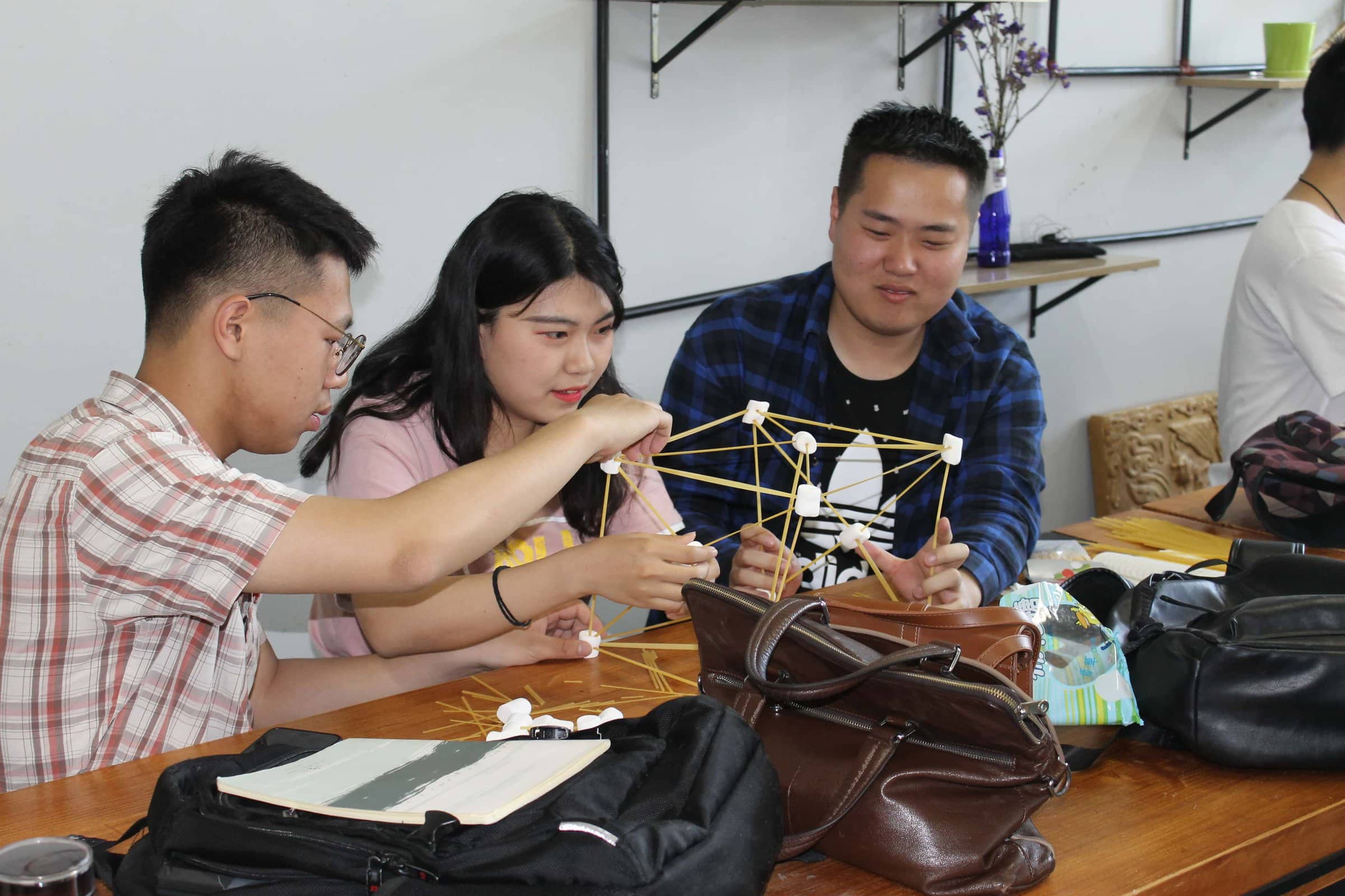 students building with marshmallows and sticks