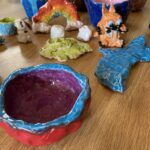 Figurines and pottery created and painted by the Brownie Girl Scouts