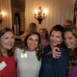 Alumni Director Ashley Carter posts with alumnae in New Orleans