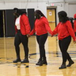 A dance group preforms at the pep rally.