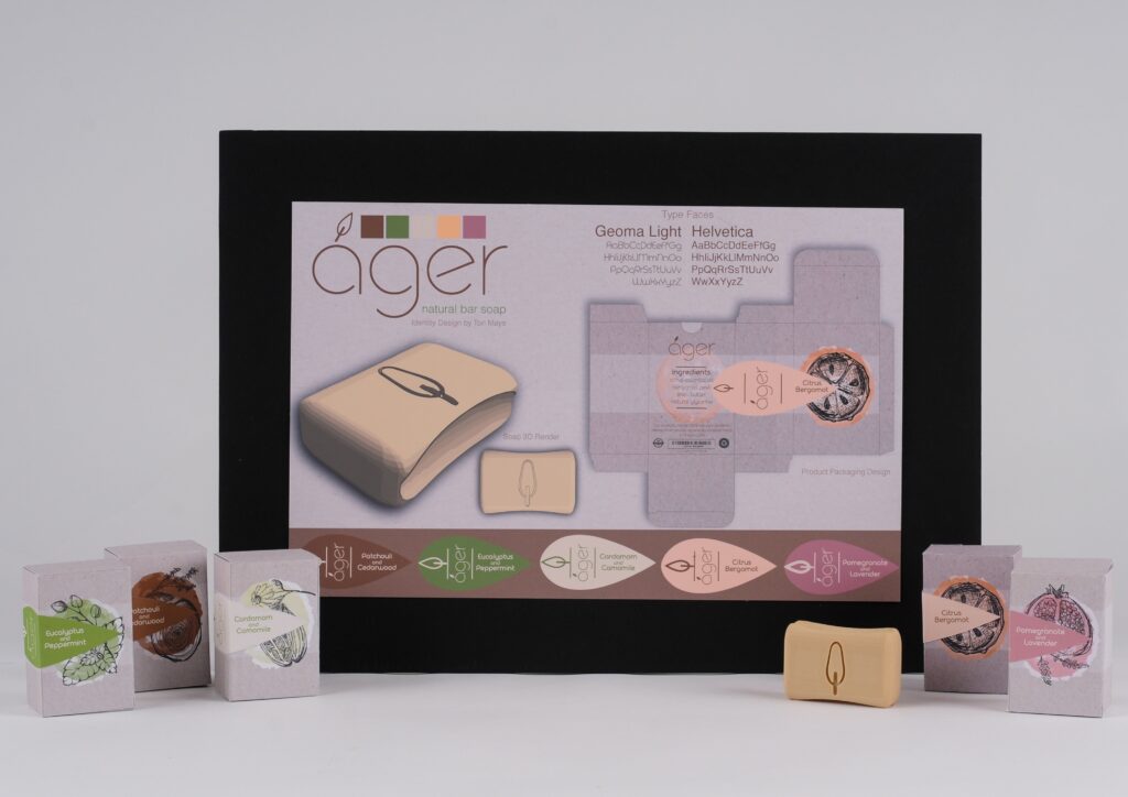 The student work featured here is a board presenting identity design for a soap company. There is a 3D printed prototype of a bar of soap and prototypes of several package variations.