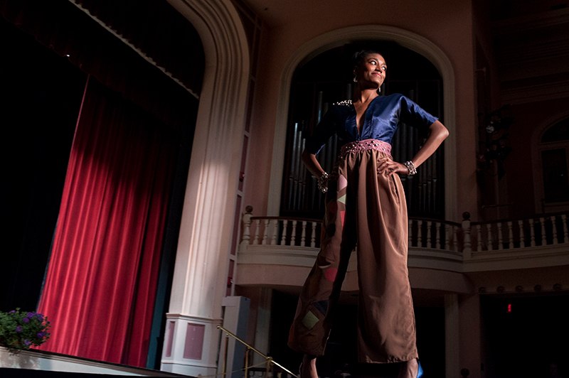 A model wearing an outtfit from Brenau fashion merchandising student Candice Jenkin's line 'Freedom' stirkes a pose at the end of the catwalk in the historic Pearce Auditorium on Brenau University's Gainesville campus.