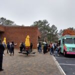 Students at the North Atlanta campus line up for the donut truck on Halloween.
