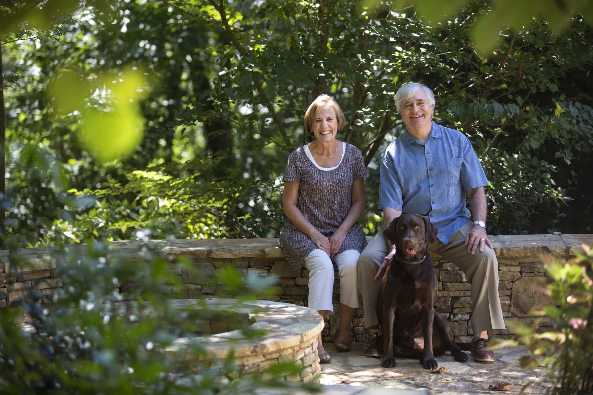 Schrader with wife Myra and their chocolate lab Jake at their home in Gainesville in 2015.