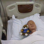 A tiger mascot plush is posed in the simulation lab at the North Atlanta campus as part of the fun this fall for Spirit Week.