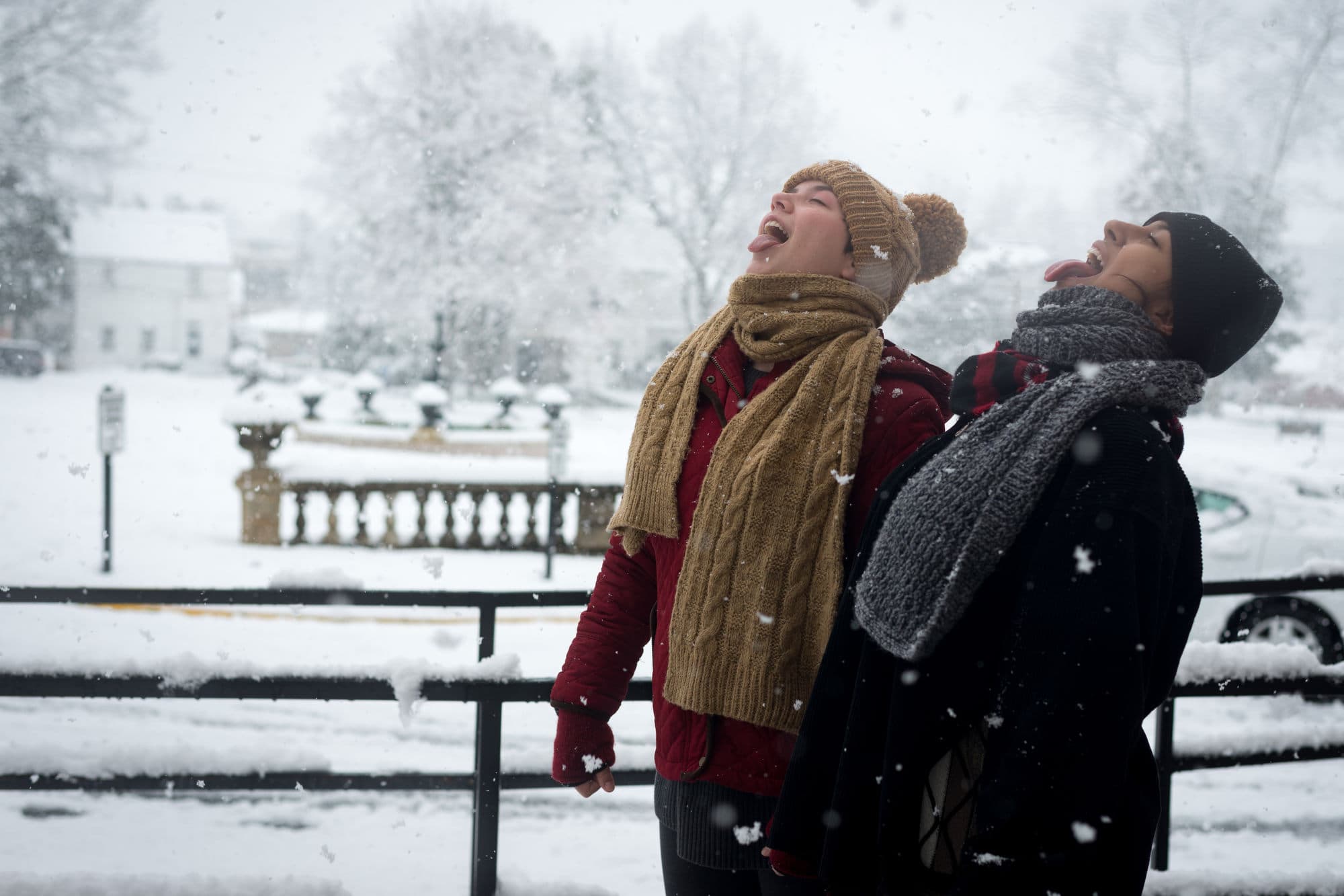 Students catch snowflakes on their tongues