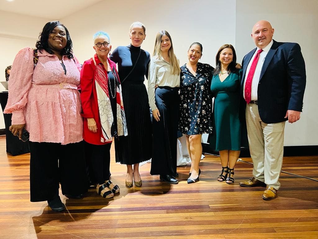 Members of the Brenau community and Costa Rican officials pose for a photo together.