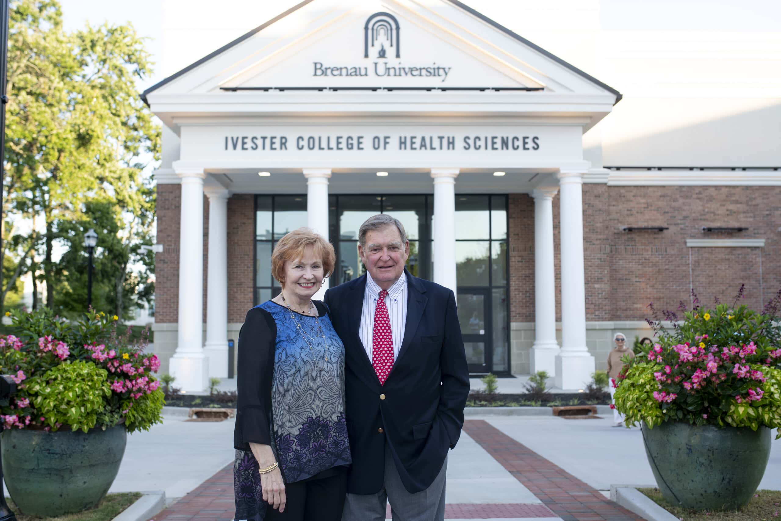 Kay and Doug Ivester outside of the Ivester College of Health Sciences.
