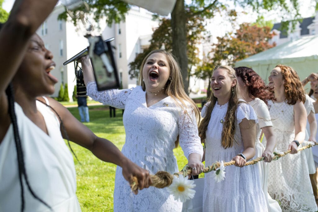 Student carrying a rope as part of class day tradition