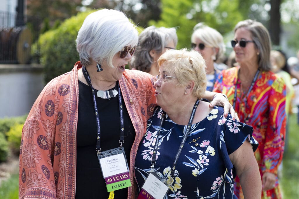 Two Brenau alumnae share a hug during Alumni Reunion Weekend 2022.