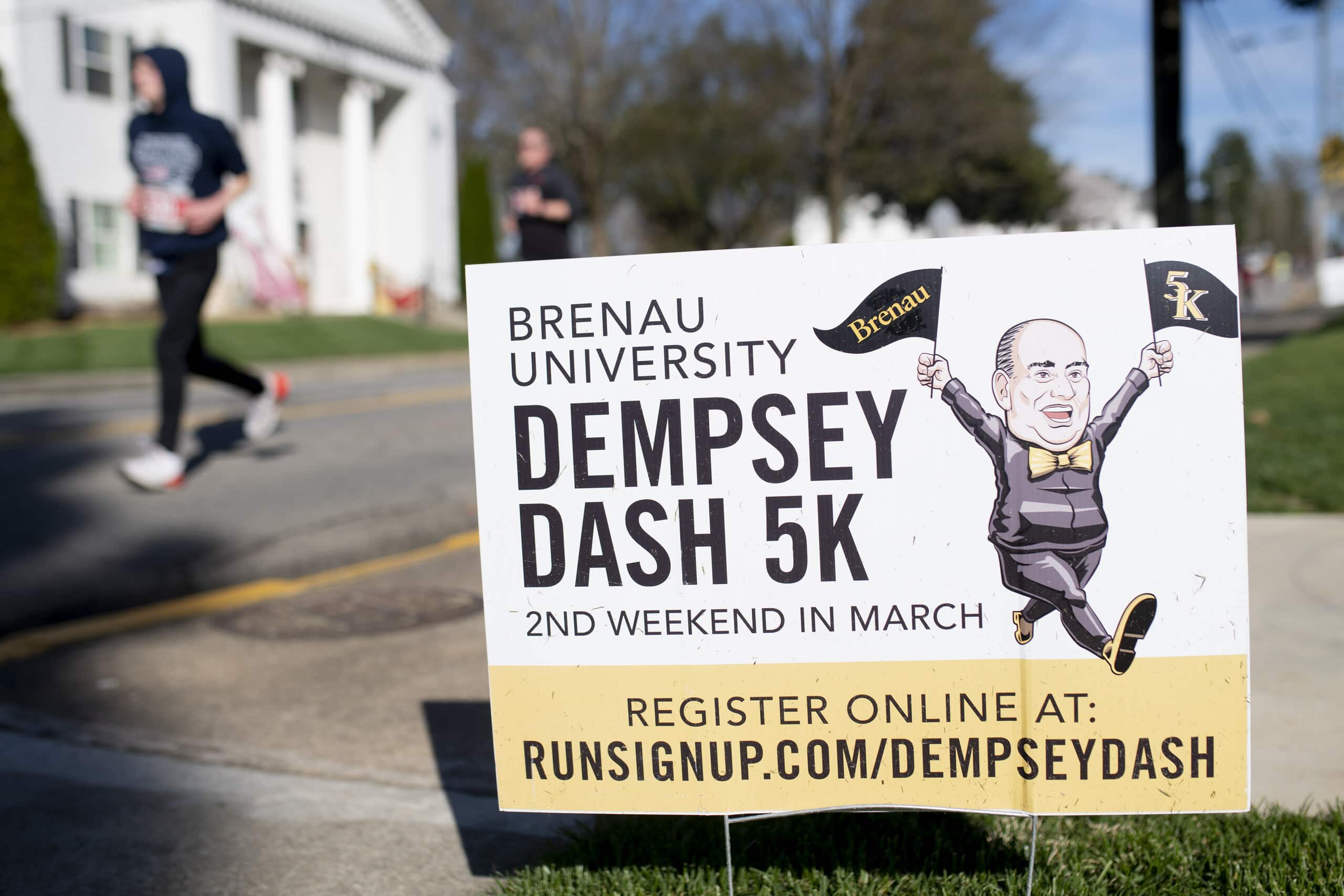 A Dempsey Dash 5k yard sign on the route.