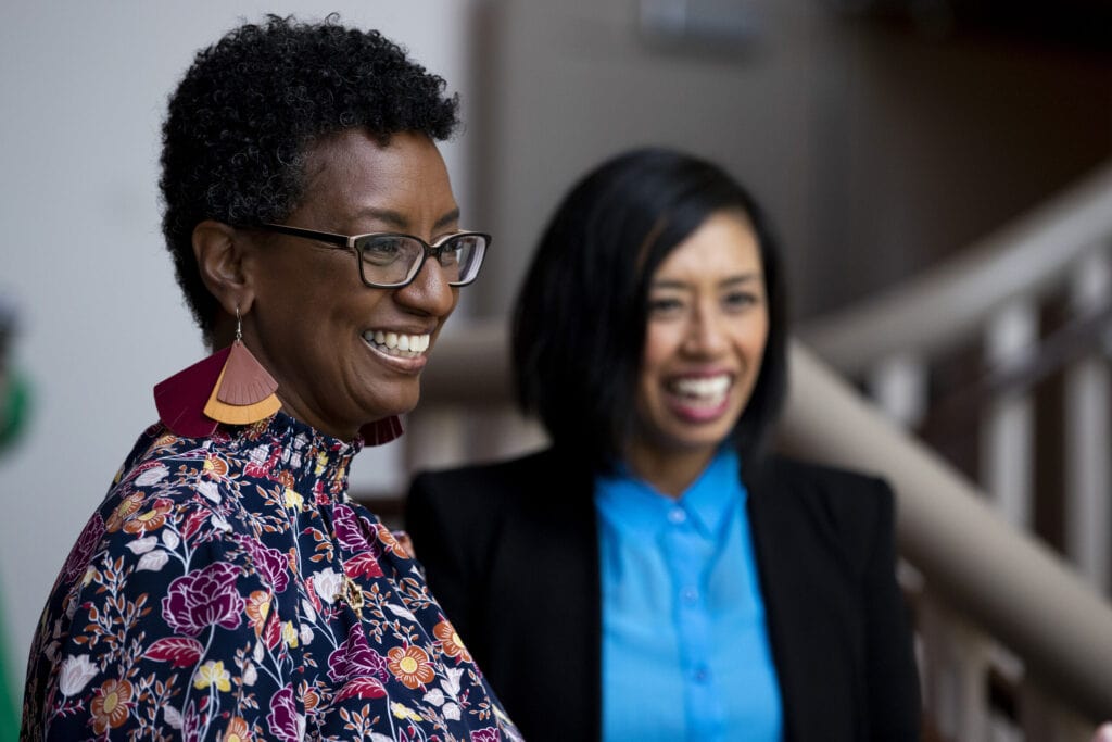 two women laugh for Women's Leadership Colloquium