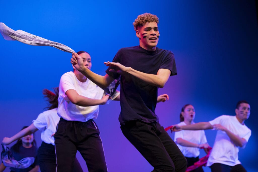 dancers perform on stage for Women's Leadership Colloquium