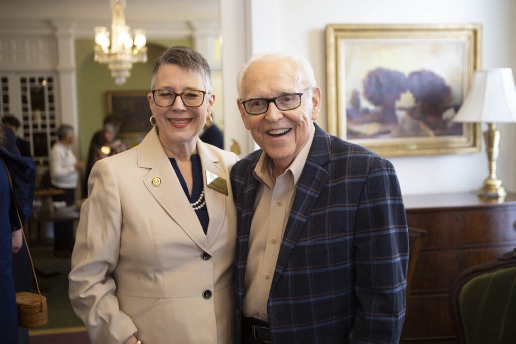 Current Brenau President Skleder stands with former President Burd