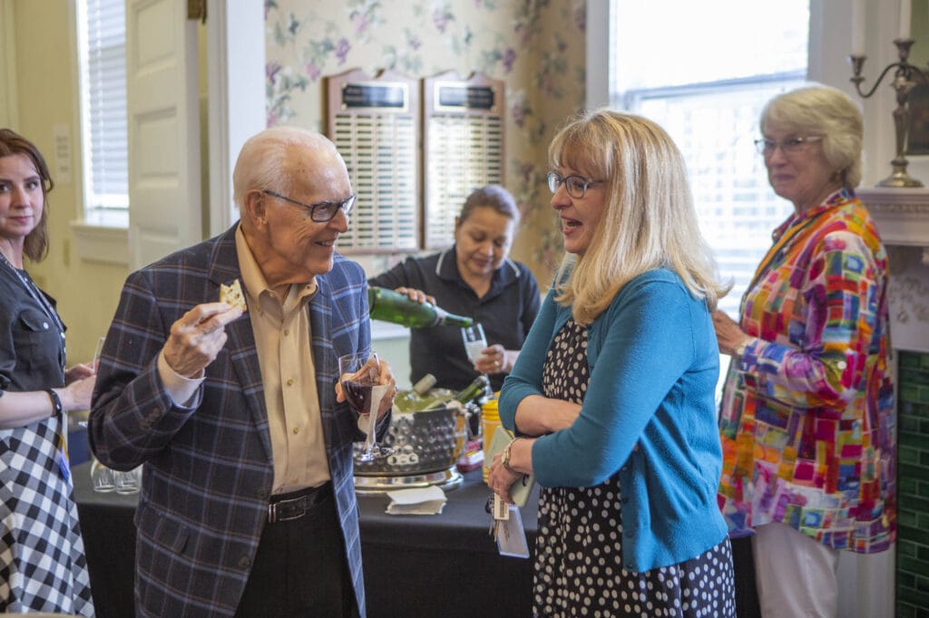 Dr. Burd talks with faculty member