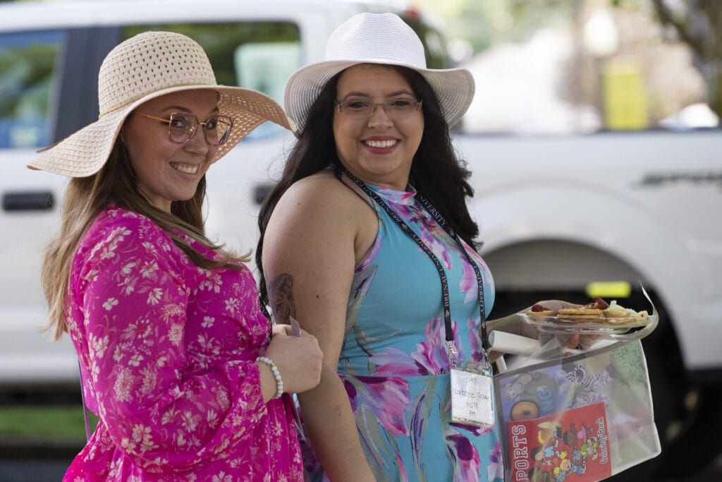 two women in spring dresses and hats