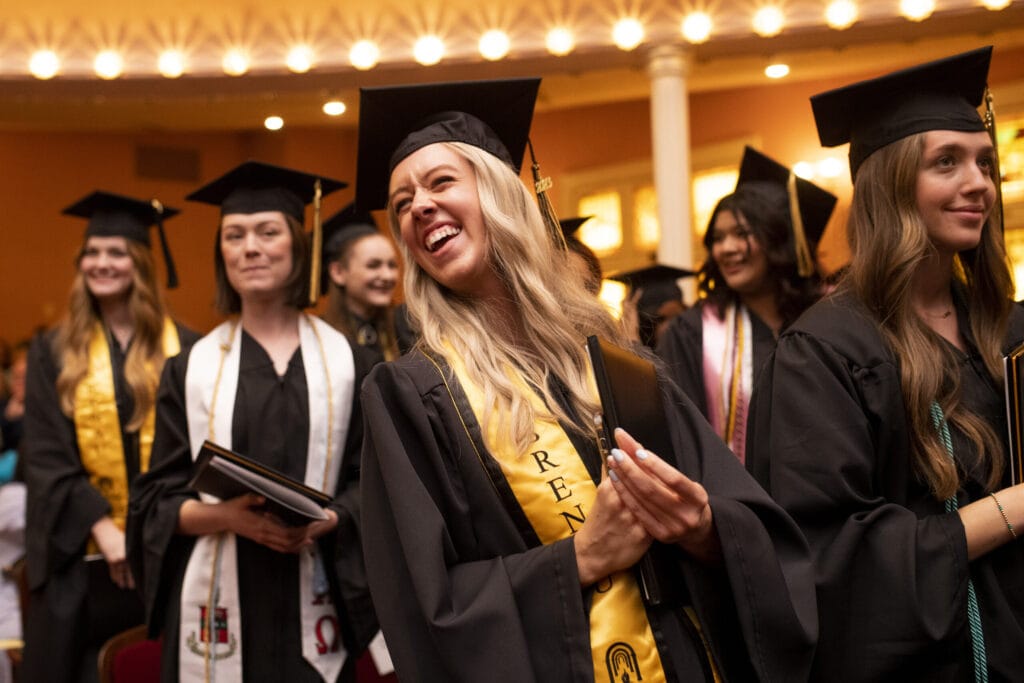A Women's College graduate is all smiles at her commencement ceremony Friday.