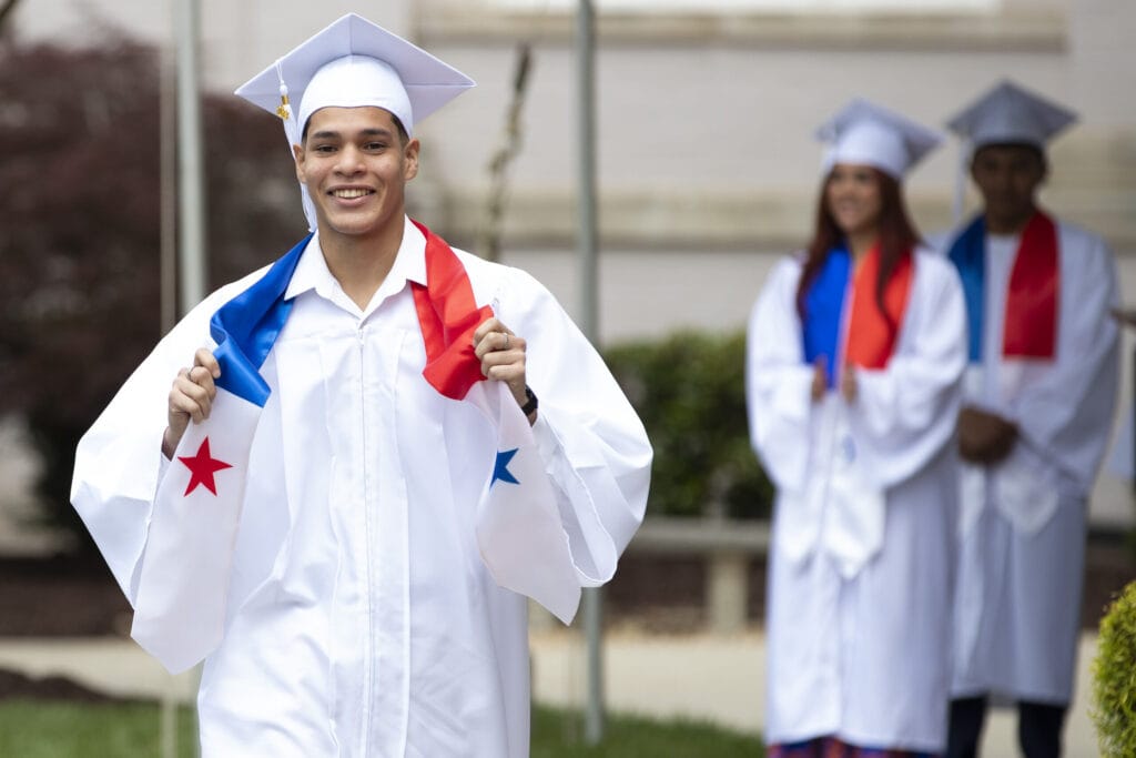 A Panamanian student earns his college readiness certificate.