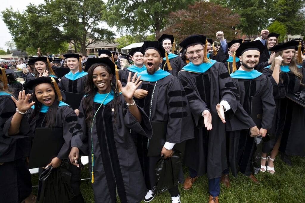 Doctoral students cheer during Saturday's commencement ceremony