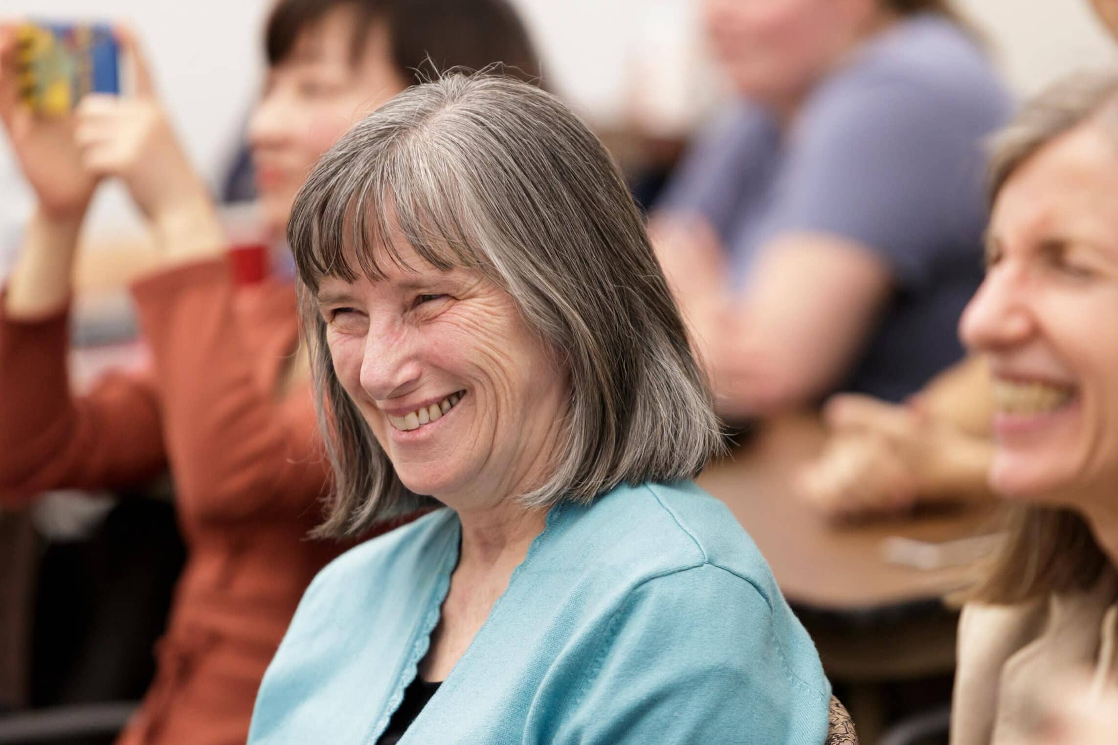 Kathryn Locey smiles during a lecture