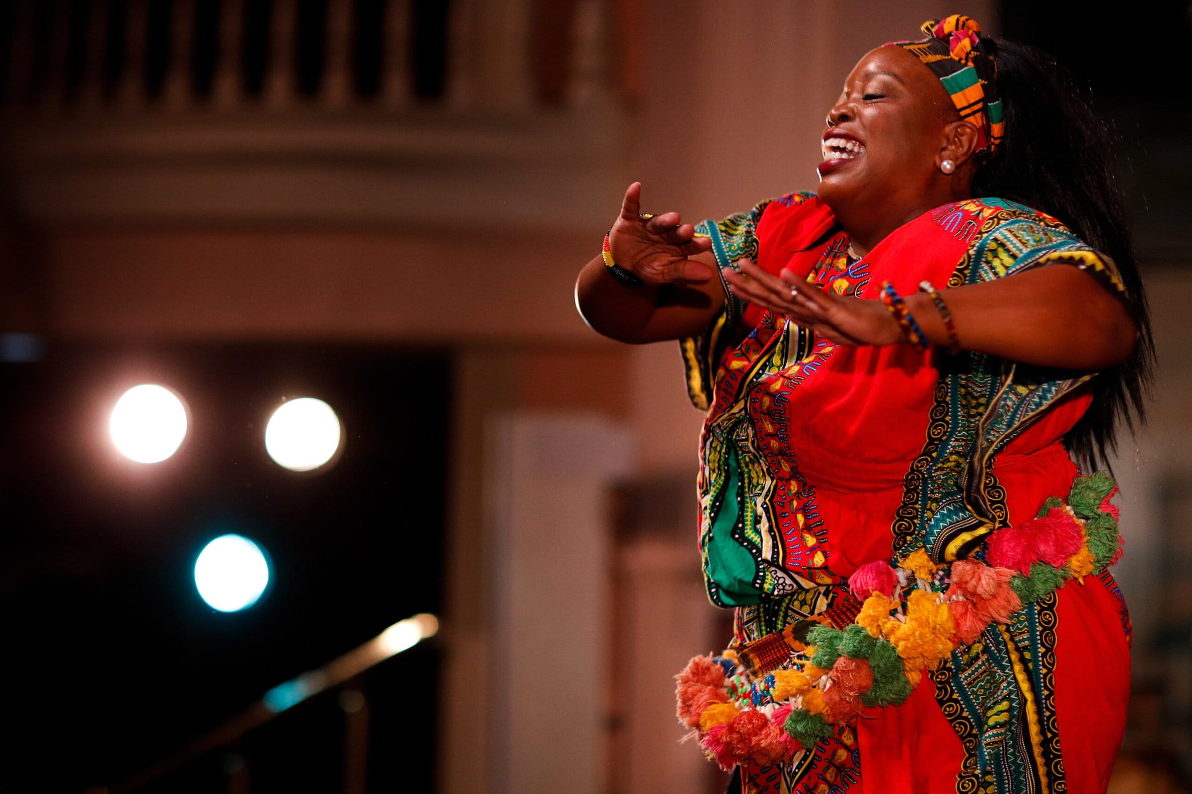 Madia Cooper-Ashirifi dances in traditional African garb during International Week.