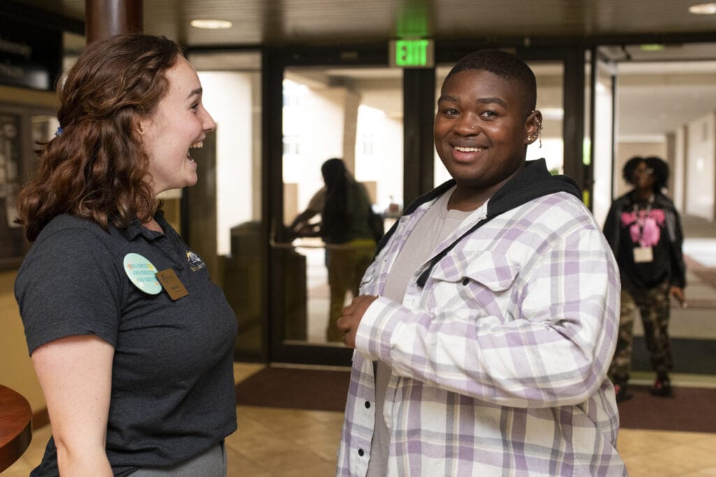 A student leader greets a new student.