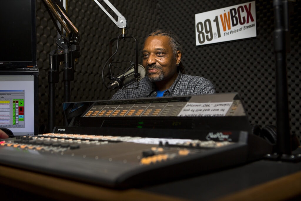 Chet White sits behind the microphone at WBCX.