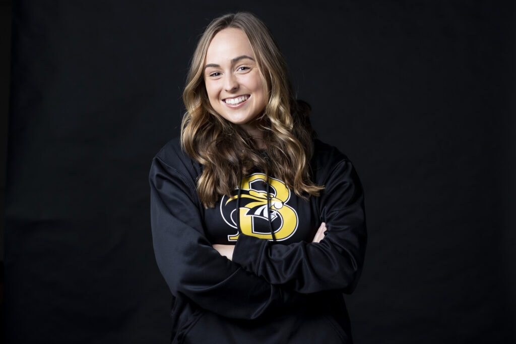 A portrait photo of Haley Bartoletta, in a black Brenau Golden Tigers hoodie.