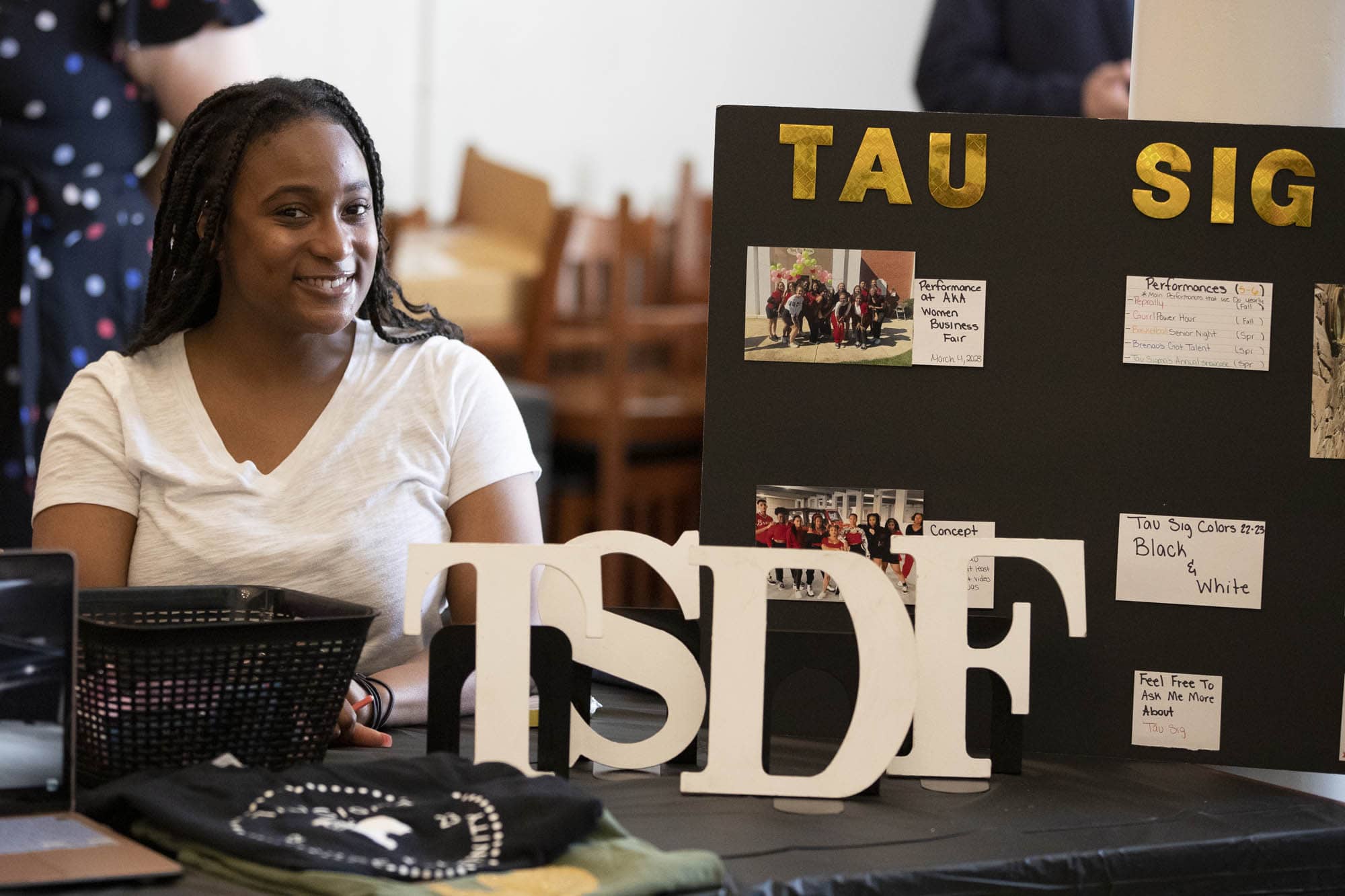 Student at a table at the org fair