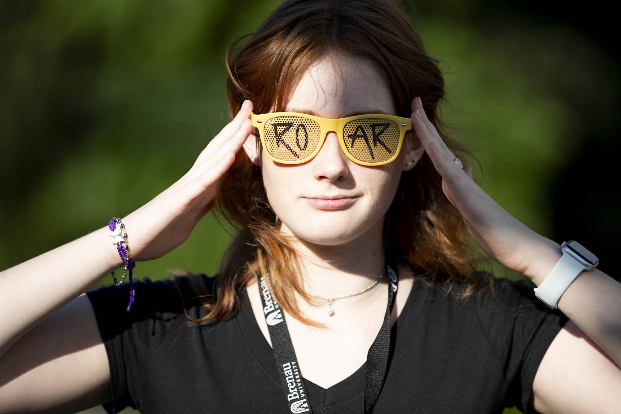 Student wearing ROAR glasses