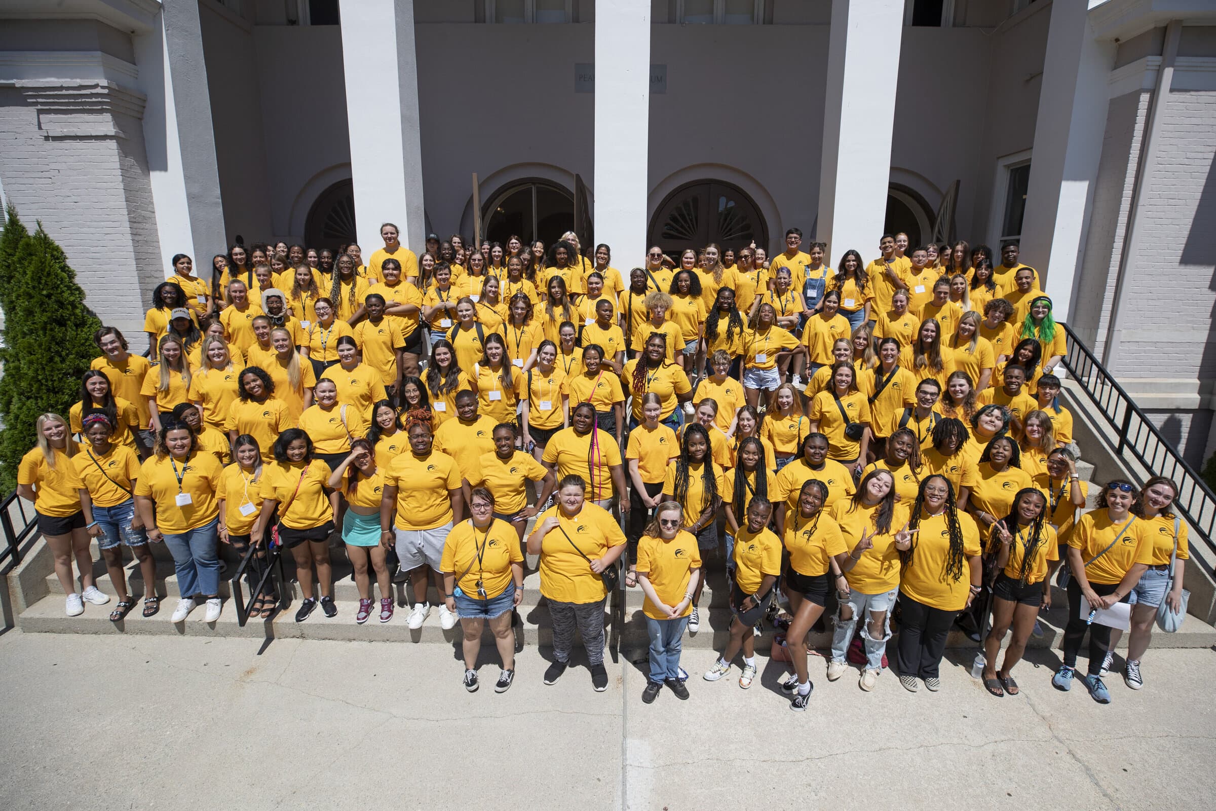Group of students in yellow shirts