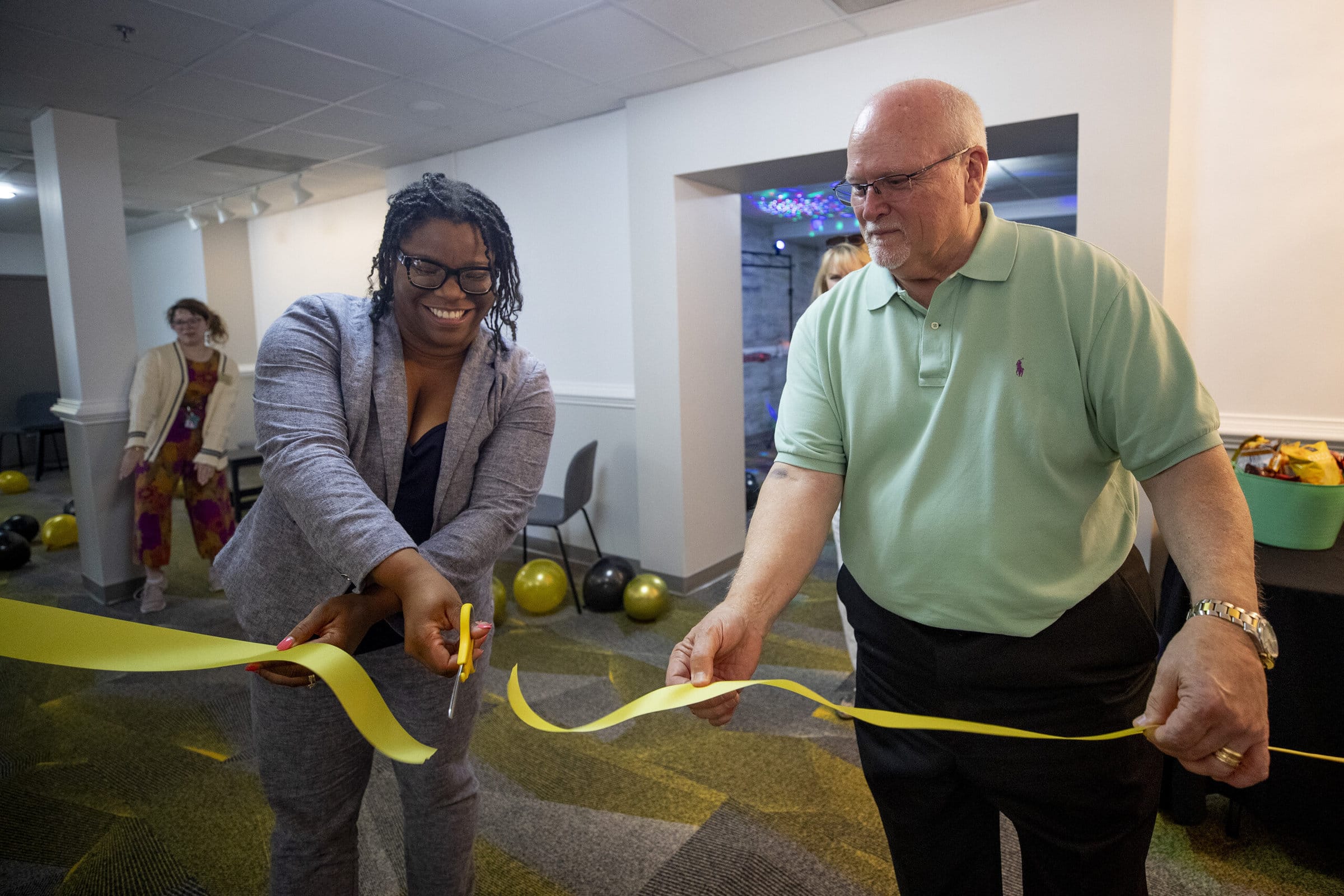Whitney McDowell-Robinson and David Barnett cut the ribbon on the new Tiger's Den lounge