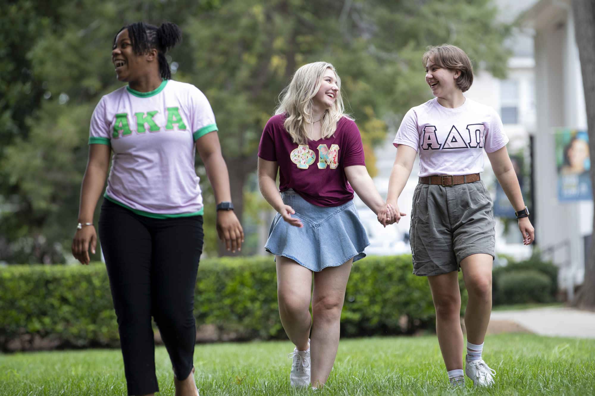 Sorority members walk on the lawn