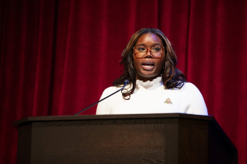 A student recites a poem at the convocation