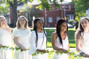 female students in white dresses