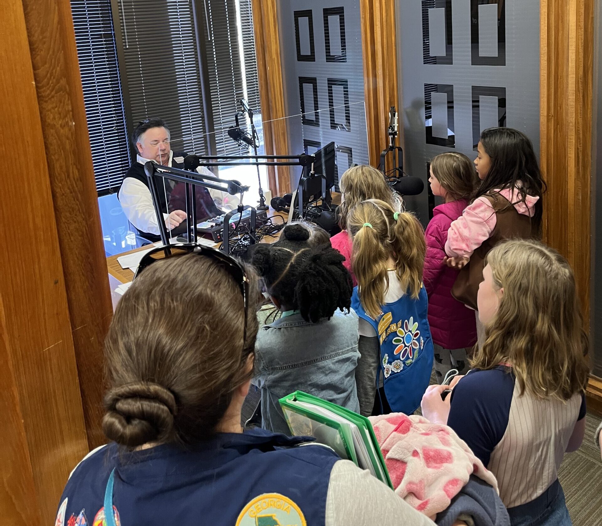 Jay Andrews shows the Girl Scouts how to record a podcast