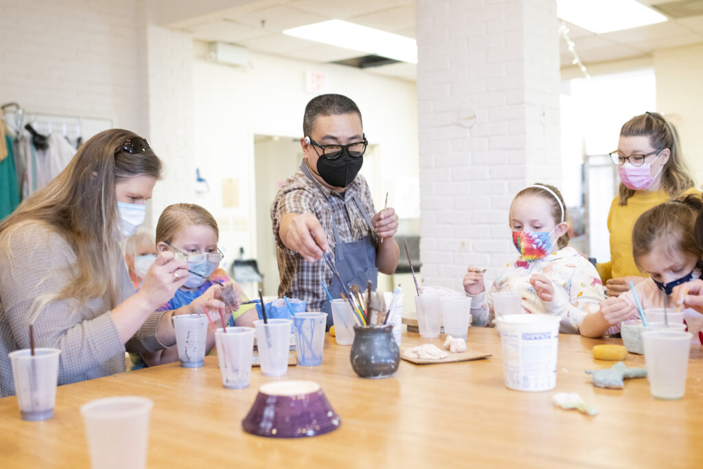 Girl Scouts paint their own pottery with Prof. Huy Chu