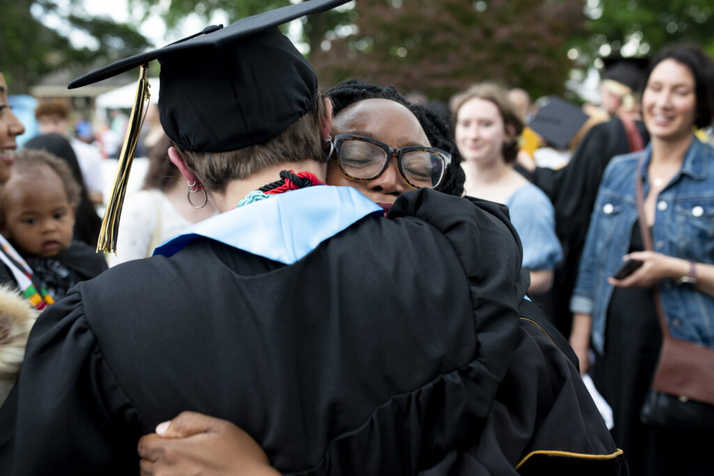 Dr. Madia Cooper-Ashirifi hugs one of her dance graduates.